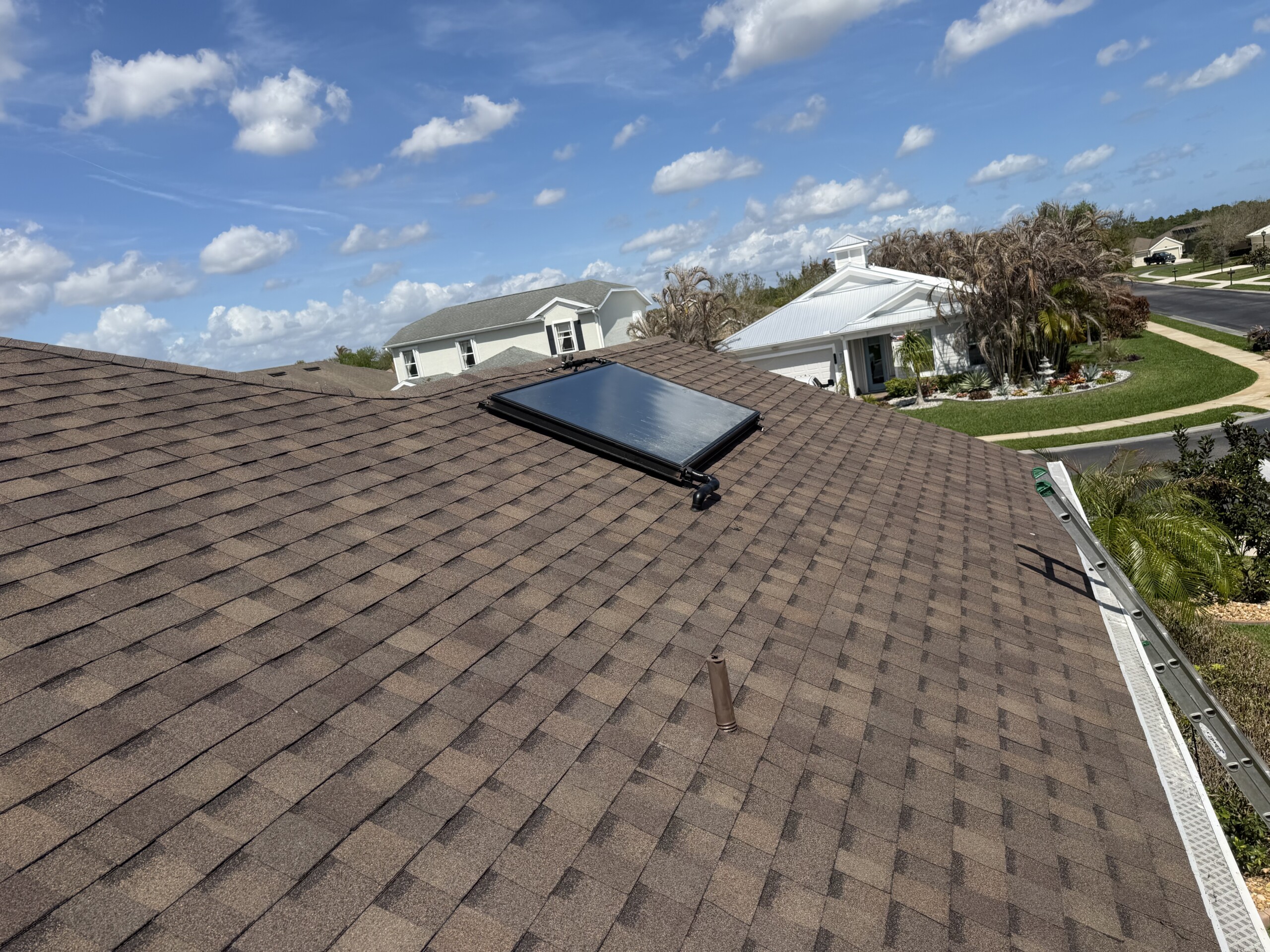 Roof-mounted solar water-heating collector on a Florida home