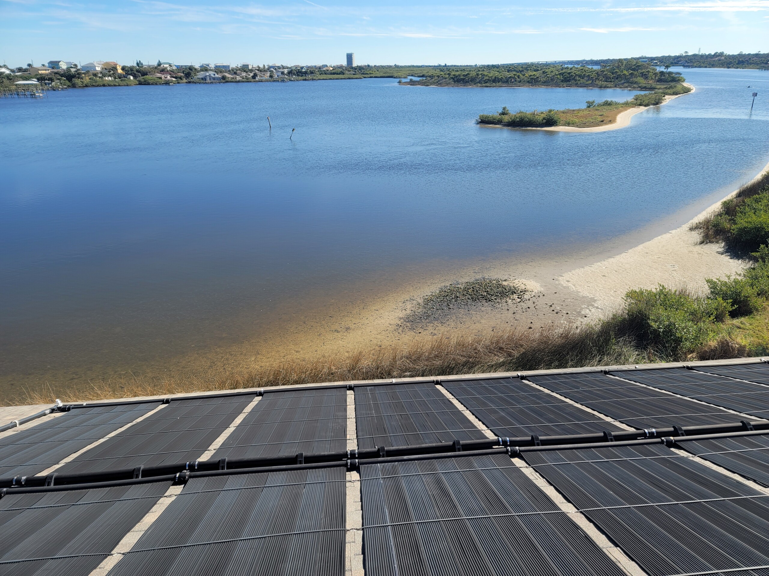 Roof-mounted solar pool-heating collectors installed by Sundial Solar Services