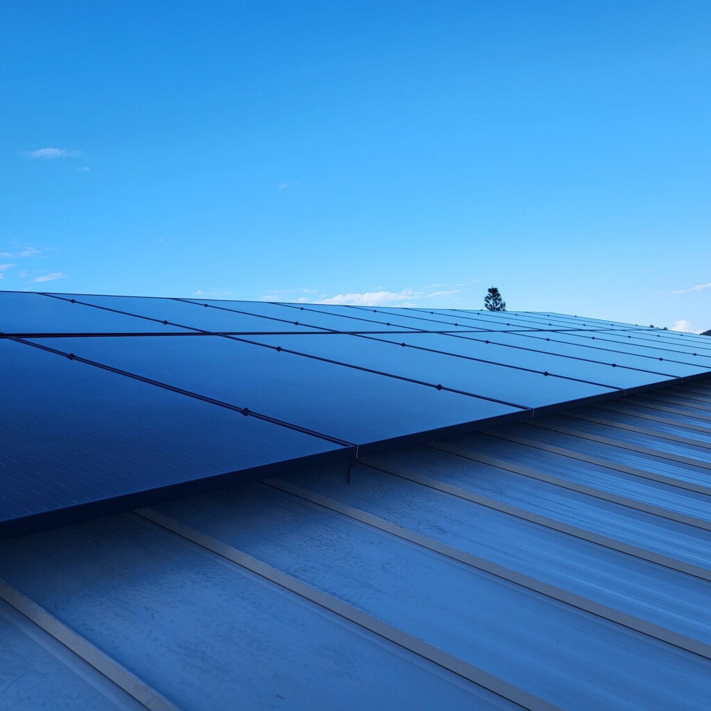 Commercial solar panels installed on a metal roof by Sundial Solar