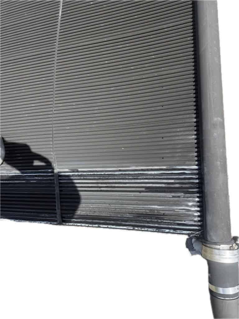Damaged solar pool heating collector requiring repair