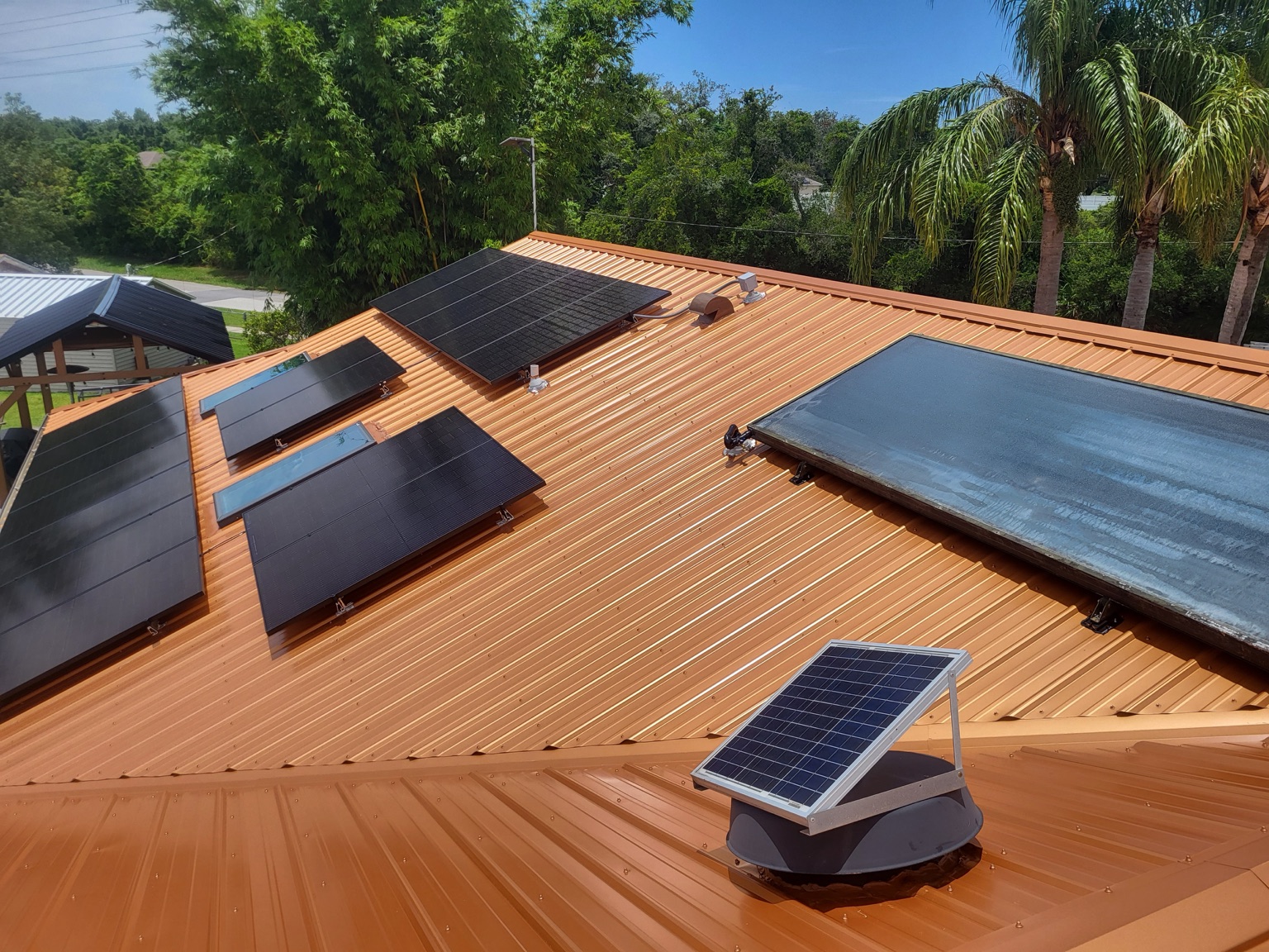 Solar attic fan installed on a metal roof