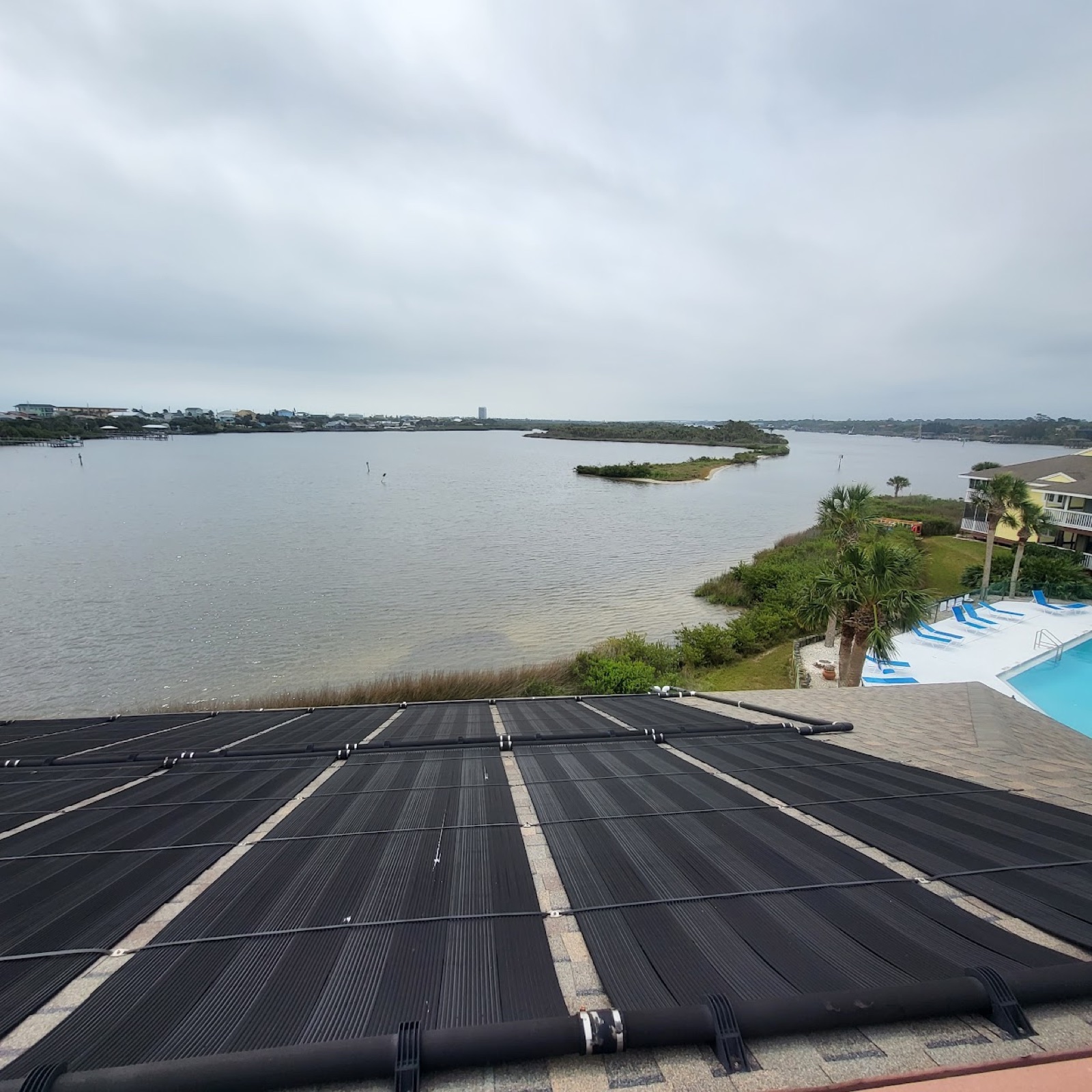Solar pool-heating collectors installed on a residential roof by Sundial Solar Services