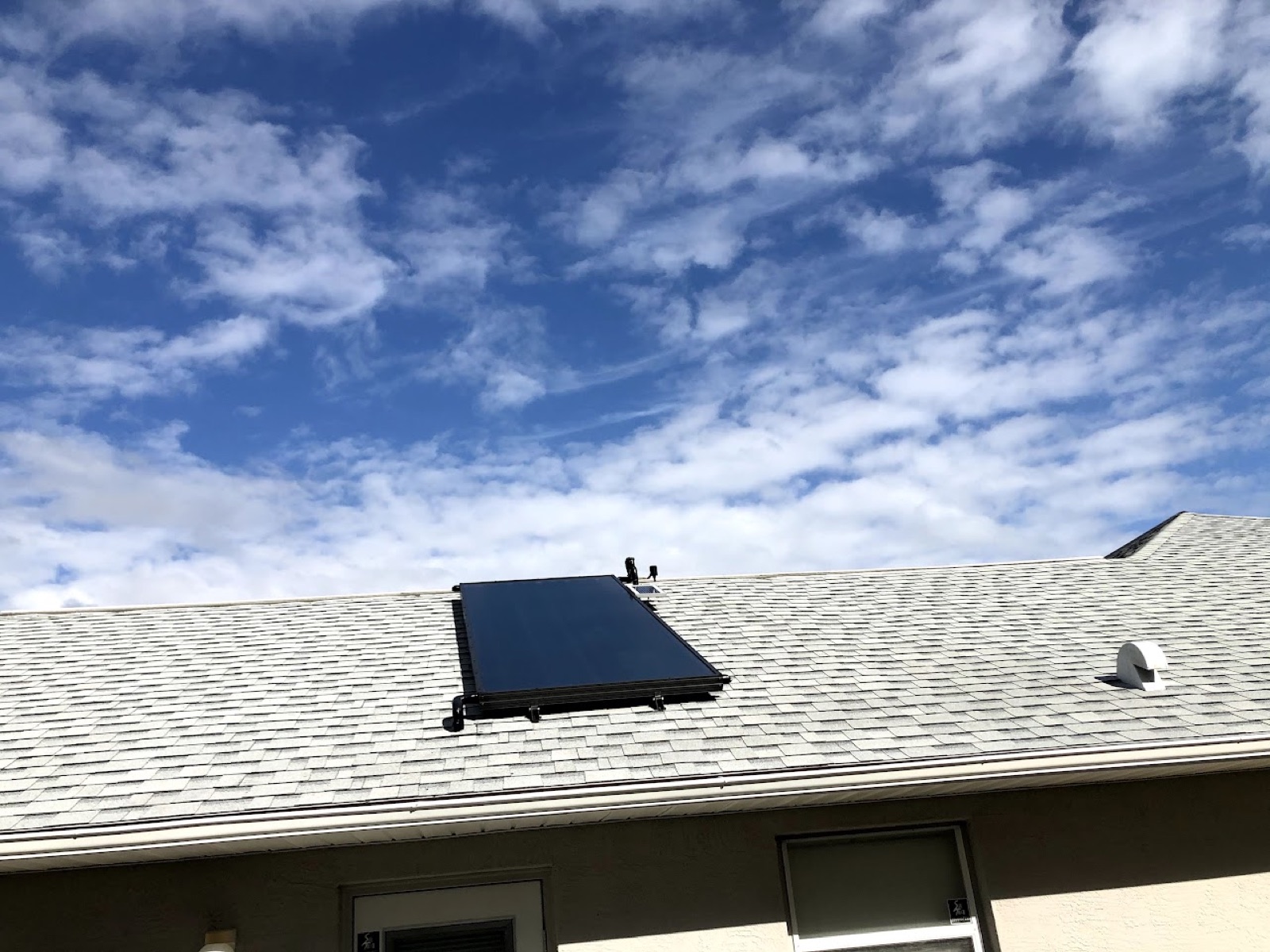 Solar water-heating collector installed on a residential roof by Sundial Solar Services