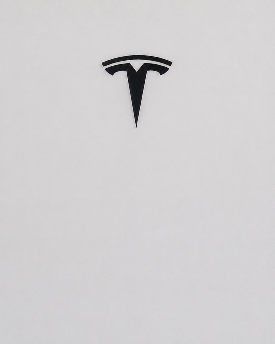 Close-up of the Tesla emblem on a Powerwall battery installed by Sundial Solar Services