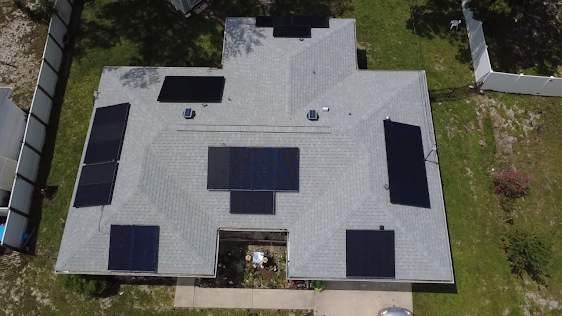 Completed Sundial solar panel array across multiple shingle-roof planes